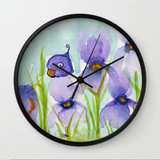 Peek a boo bird hiding in iris patch Wall Clock