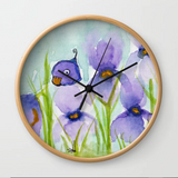 Peek a boo bird hiding in iris patch Wall Clock