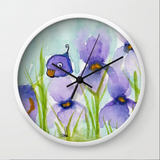 Peek a boo bird hiding in iris patch Wall Clock